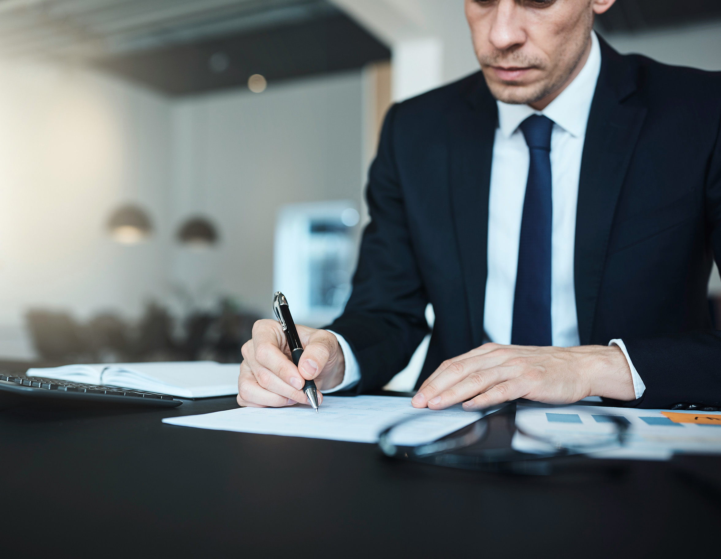 Adviser reviewing property documents at a desk